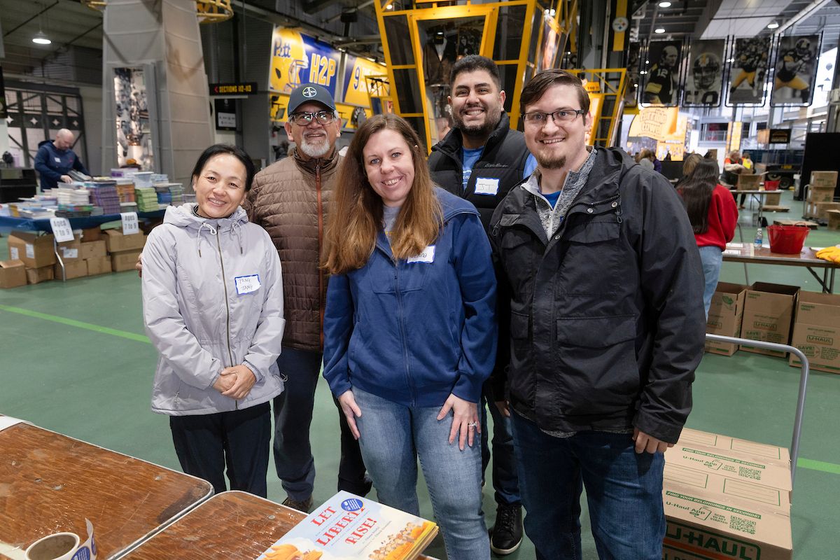A small group of people at book packing event.