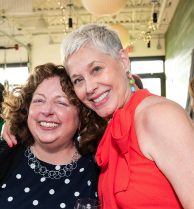 Two women posing.